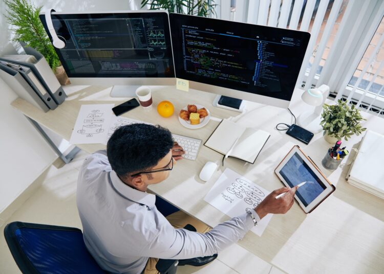 Software developer checking calendar