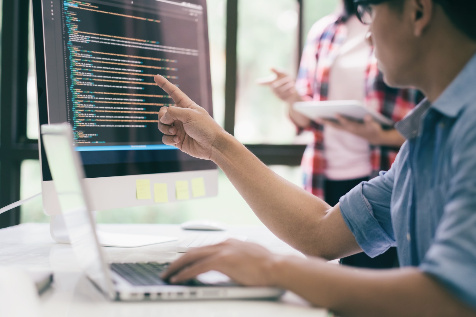 Software developer team meeting.